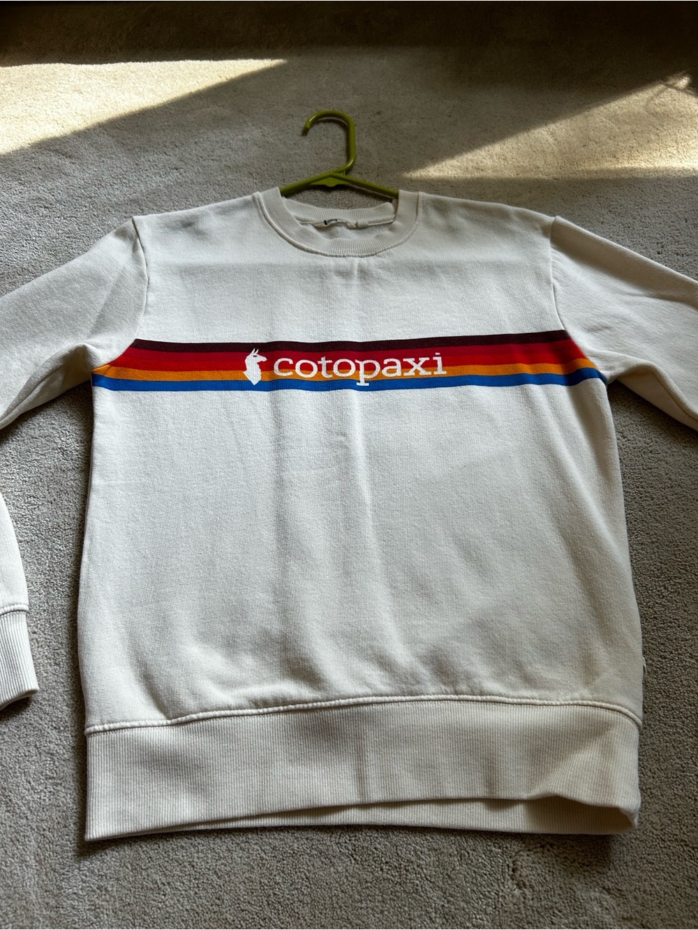 cotopaxi Cream Crewneck Sweatshirt with Red, Orange, Yellow & Blue Stripes